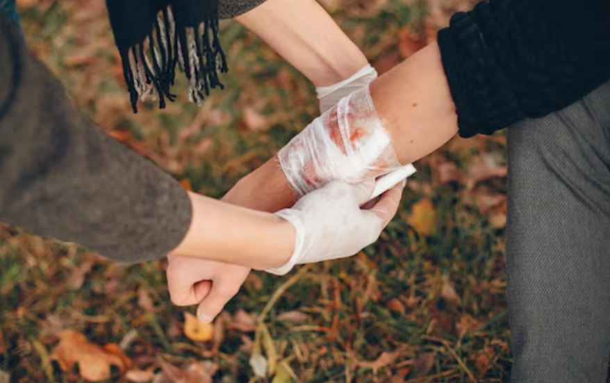 one man bandaging another