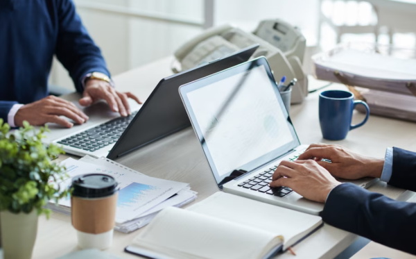 two people working on computer