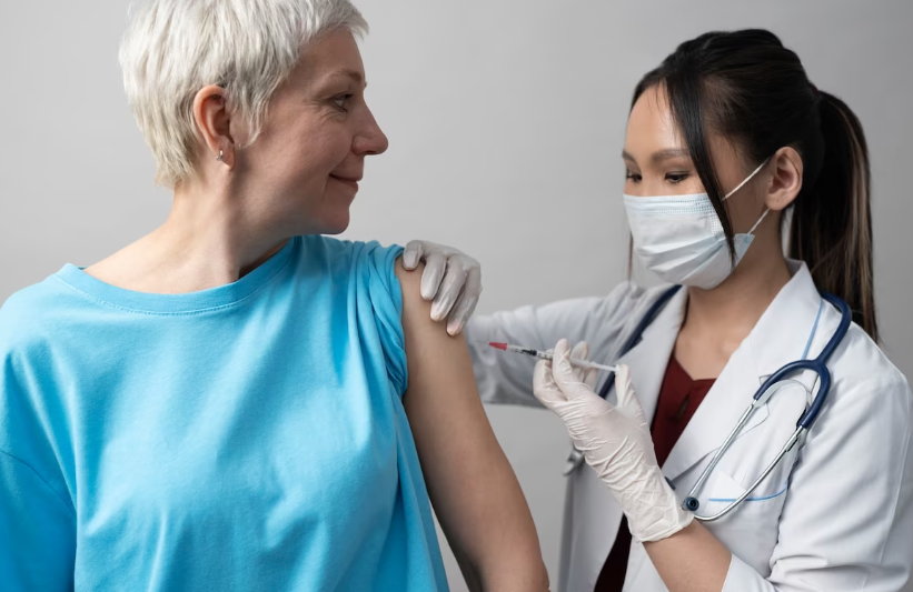 Doctor giving insulin injection to diabetic patient