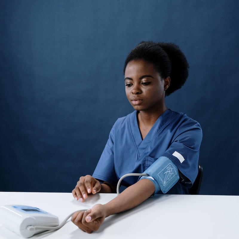 patient measuring blood pressure