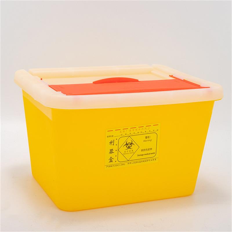 A yellow square sharps container