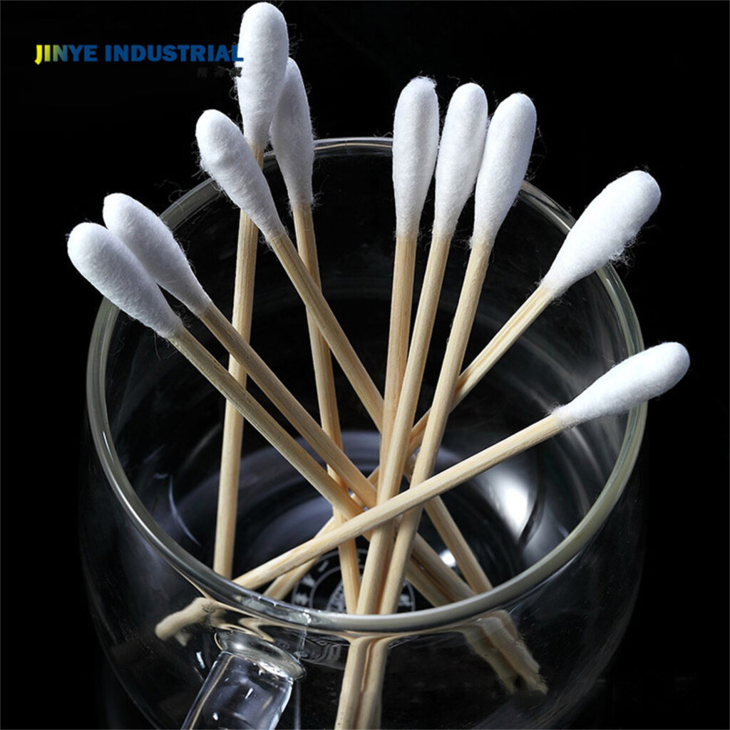 A dozen cotton swabs in a glass