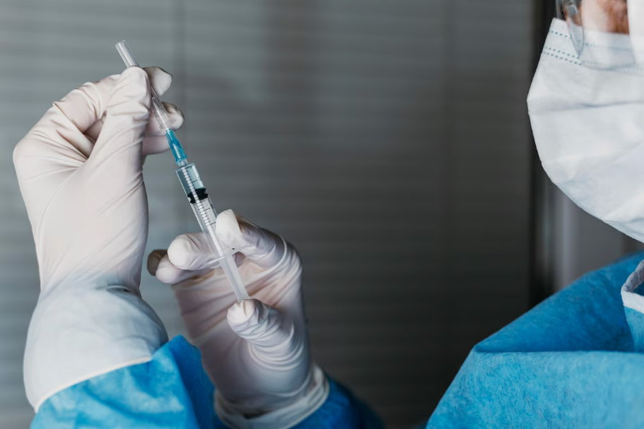 doctor holding a syringe