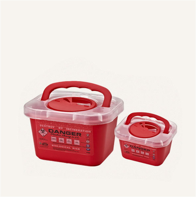 Two red square medical disposable biohazard sharps boxes